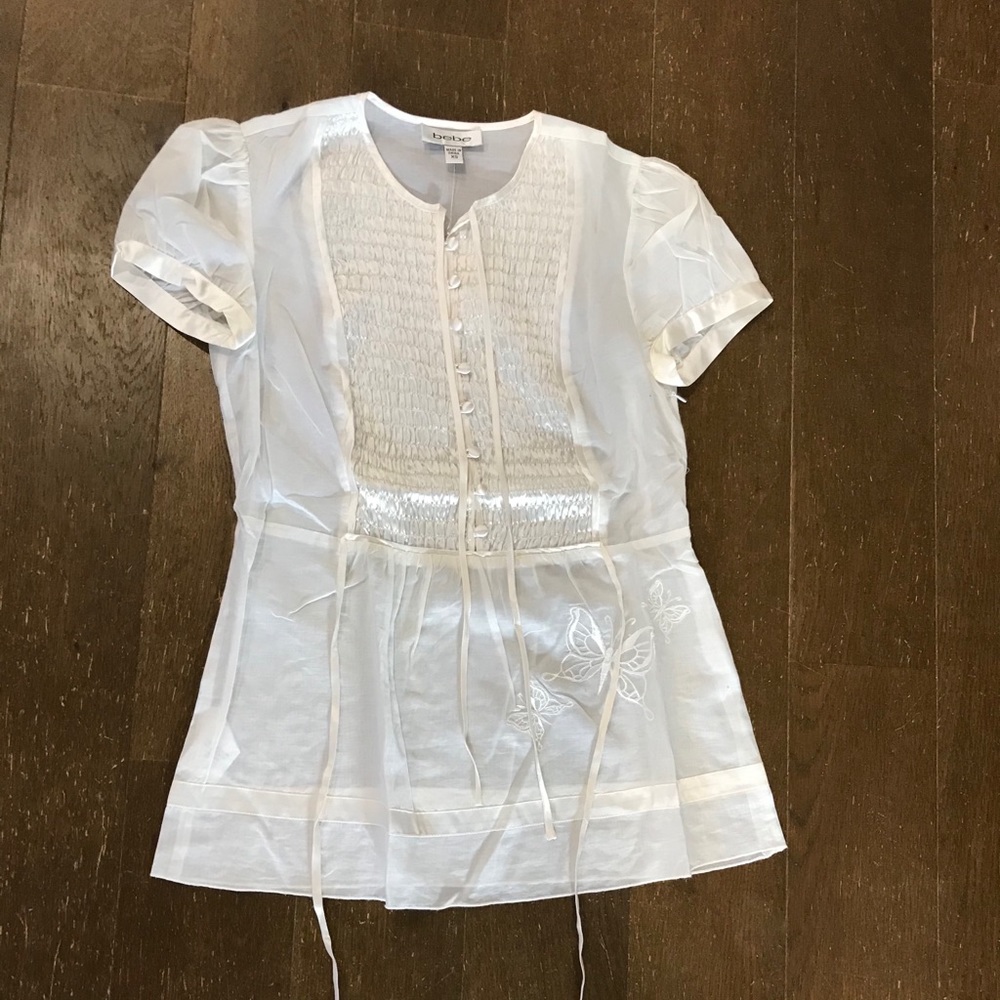 Bebe blouse with ties and embroidery peplum style
